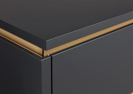 Uñero integrado en color bronce, metido en el propio mueble por encima del cajón